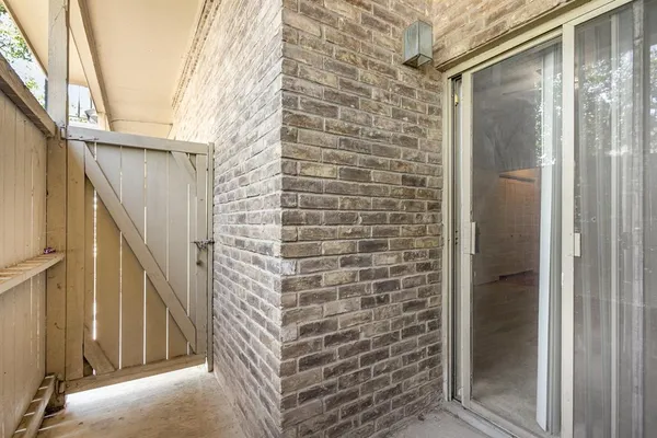 a view of a street with a building in the background