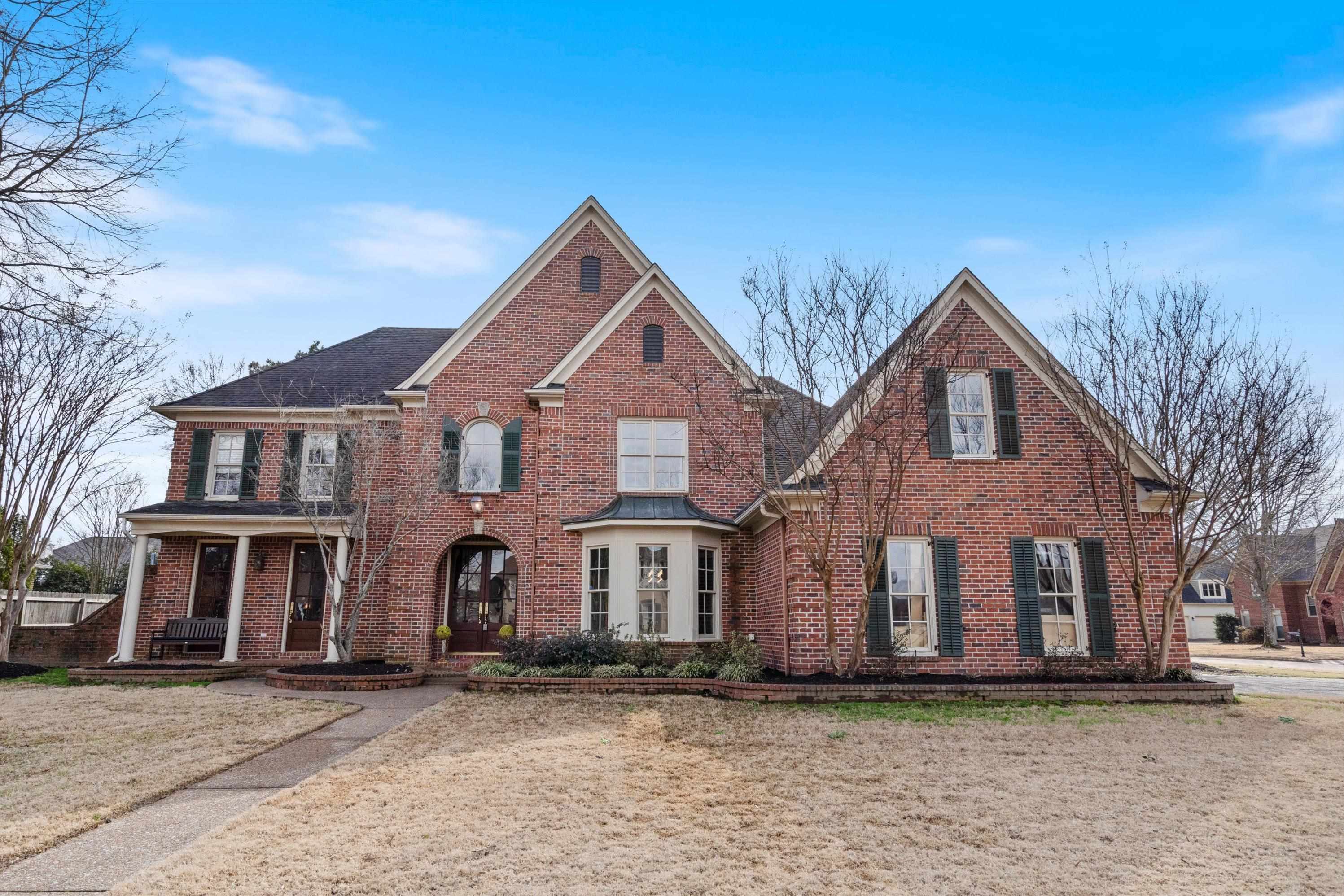 View of the front of house with double entry doors