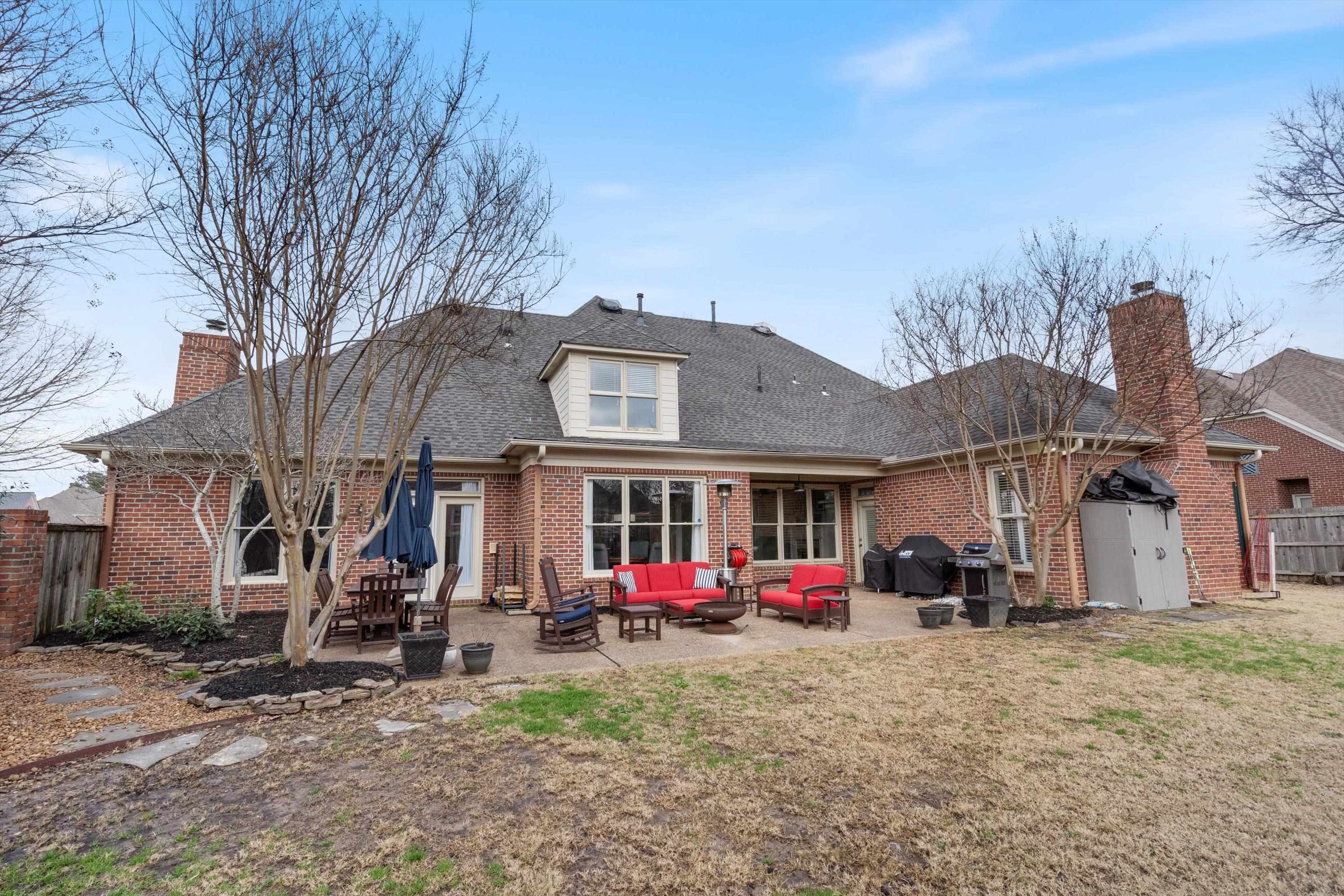 9335 Gresham Cove Germantown, TN 38139 - Photo 33 of 40 Rear view of the home. Level yard and plenty of space