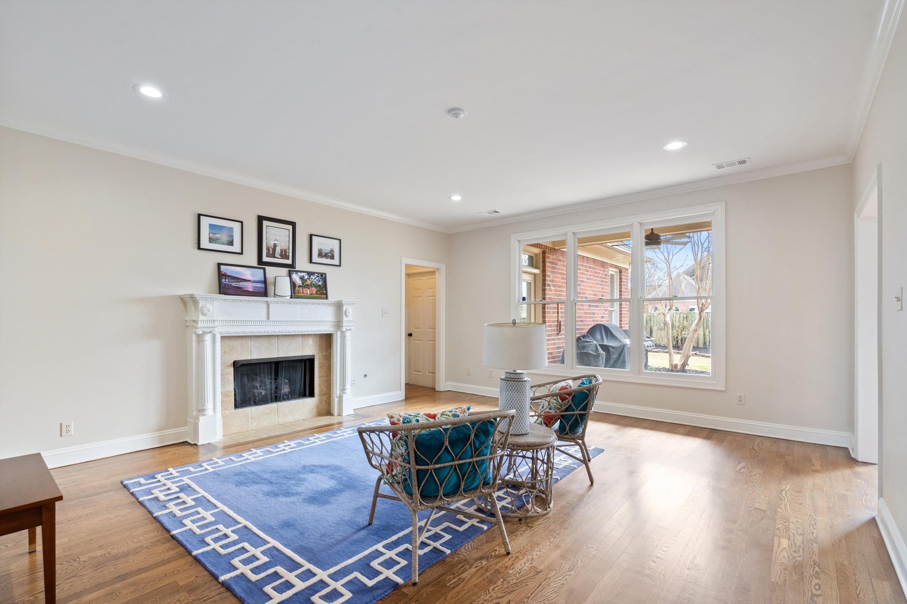 9335 Gresham Cove Germantown, TN 38139 - Photo 8 of 40 Living Room with hardwood and tiled fireplace