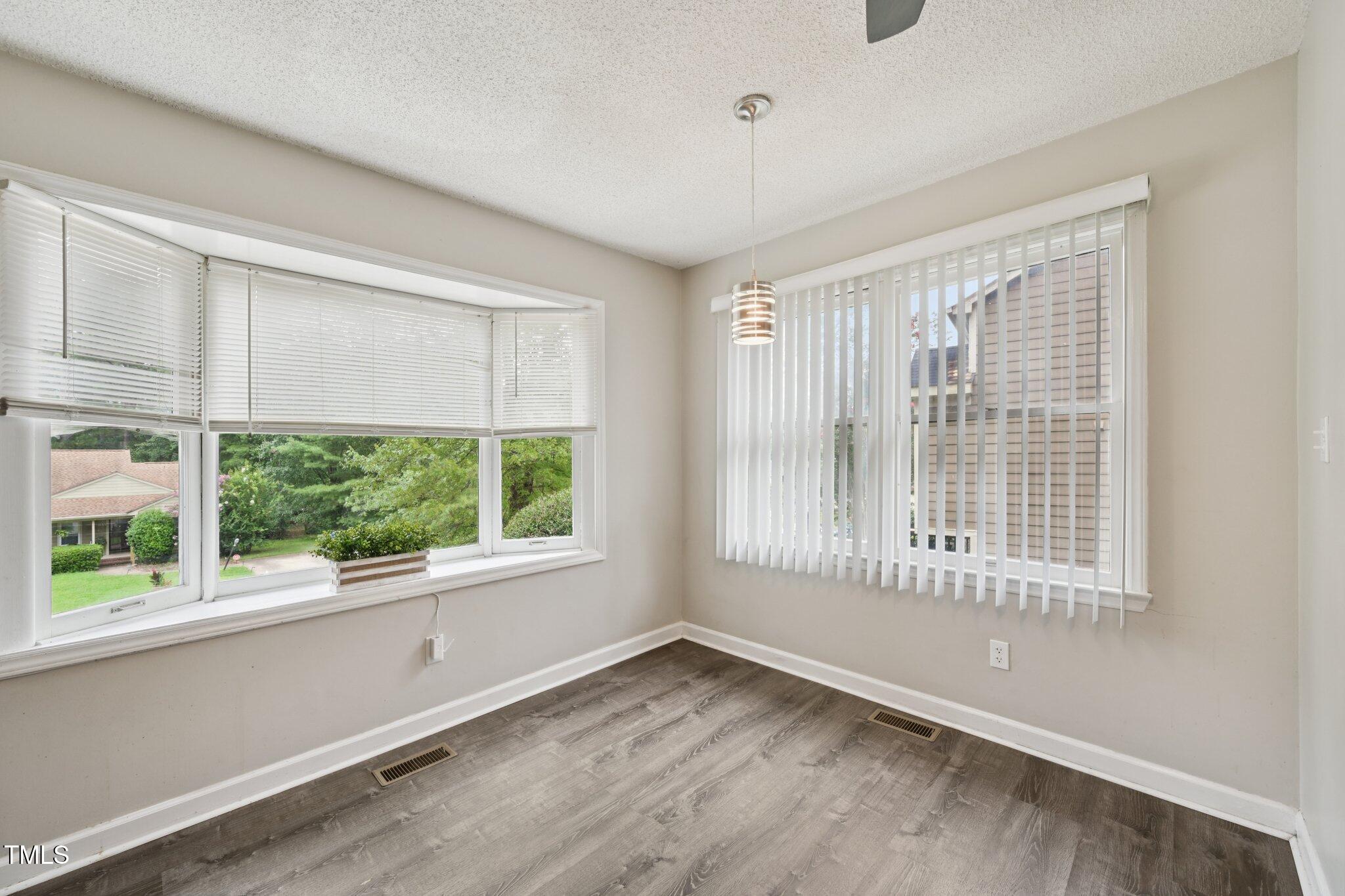 3534 Rawdon Drive Durham, NC 27713 - Photo 18 of 43 a view of an empty room with a window