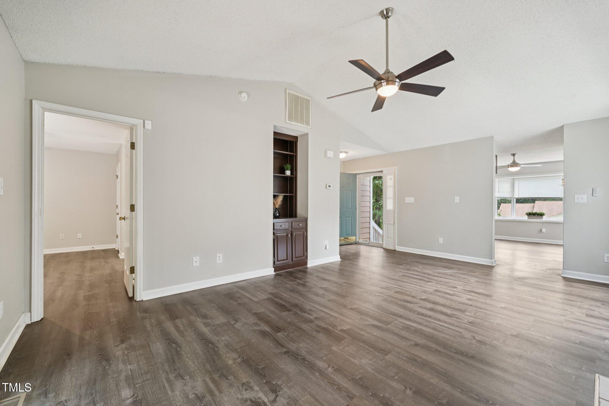 3534 Rawdon Drive Durham, NC 27713 - Photo 25 of 43 a view of a livingroom with a hall and wooden floor