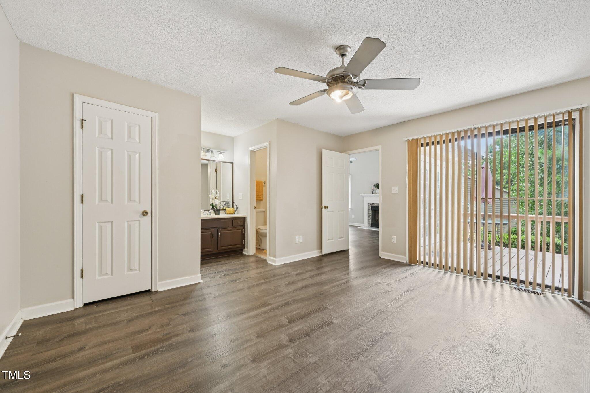 3534 Rawdon Drive Durham, NC 27713 - Photo 27 of 43 a view of a livingroom with wooden floor and a ceiling fan
