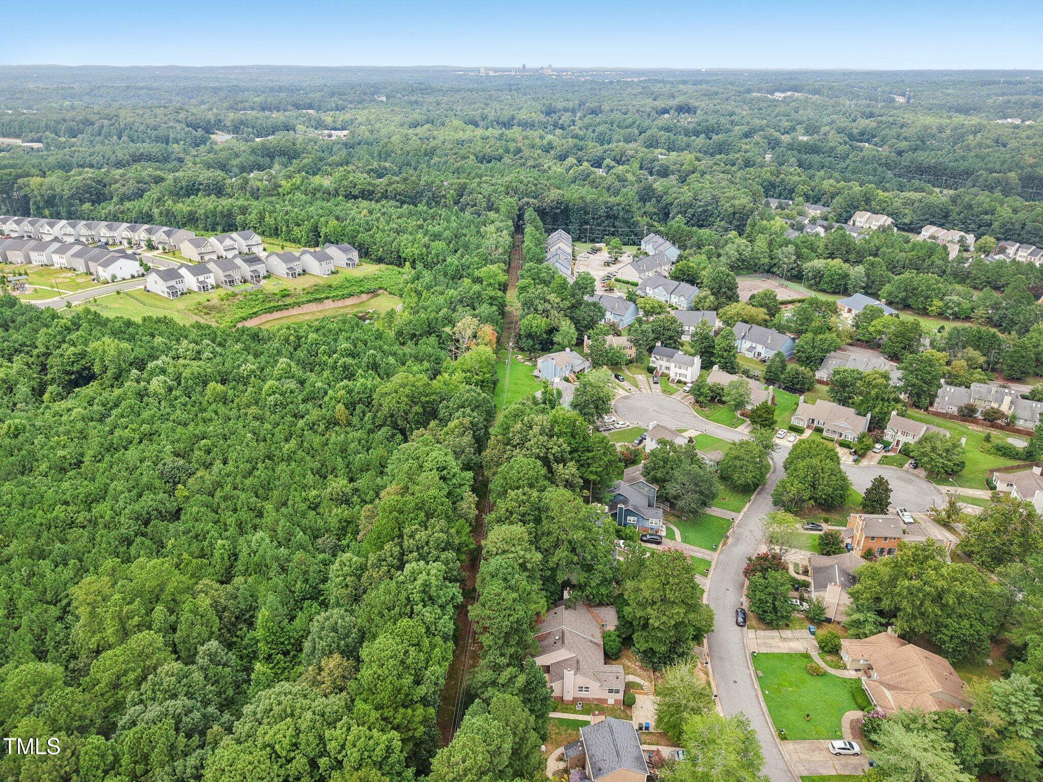 3534 Rawdon Drive Durham, NC 27713 - Photo 37 of 43 an aerial view of residential houses with outdoor space and trees