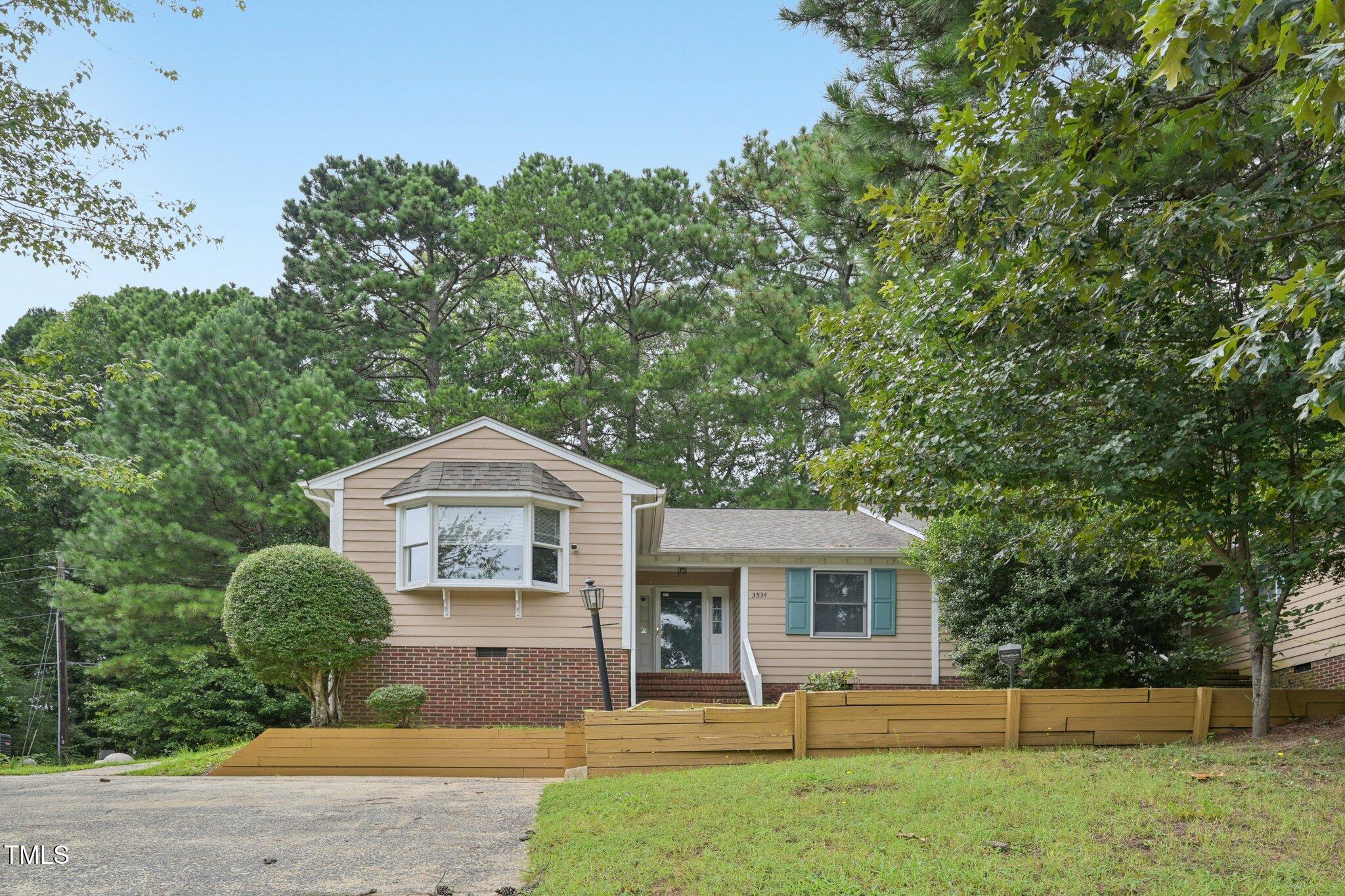 3534 Rawdon Drive Durham, NC 27713 - Photo 3 of 43 a front view of a house with a yard
