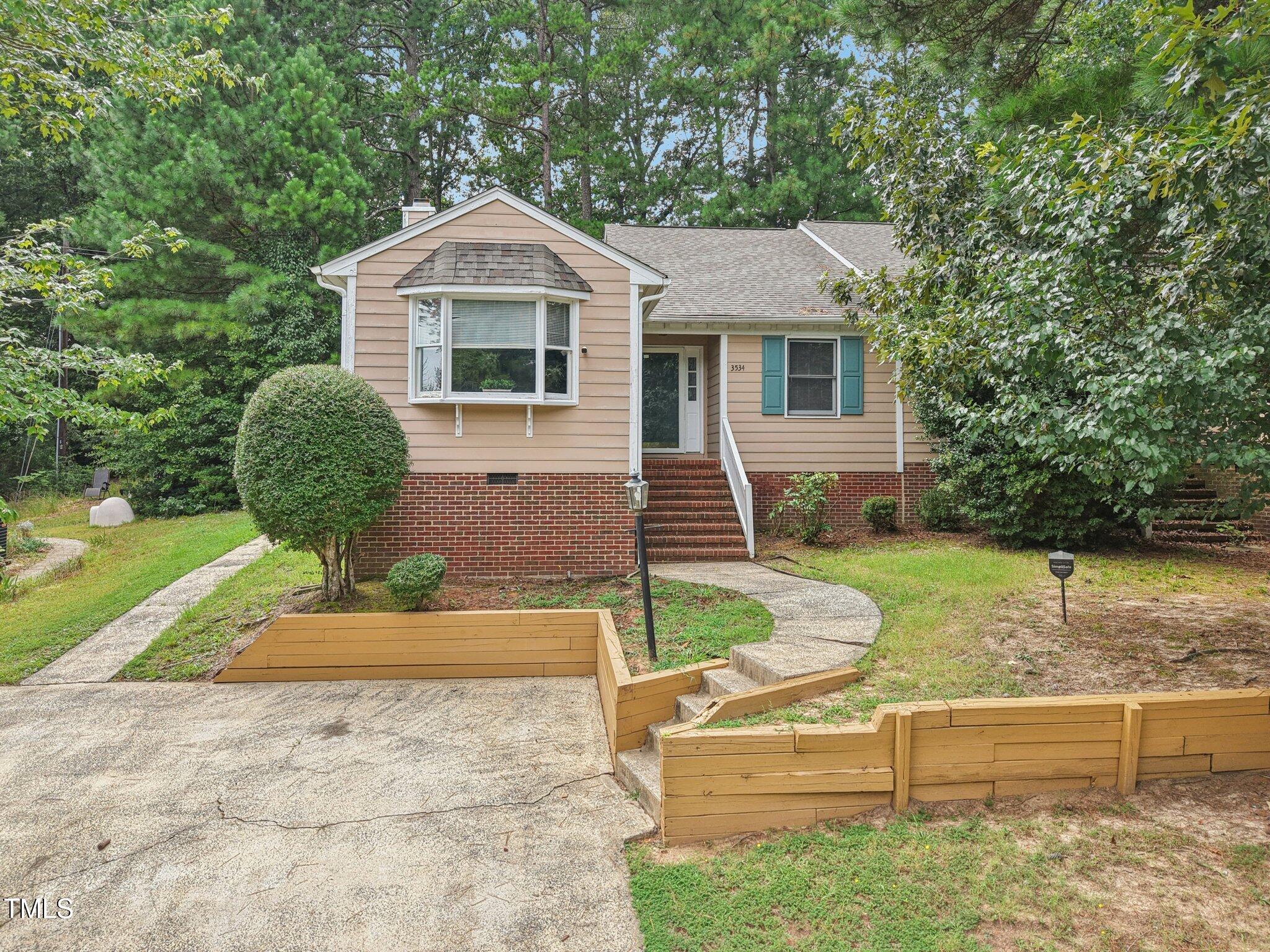 3534 Rawdon Drive Durham, NC 27713 - Photo 7 of 43 a front view of a house with garden