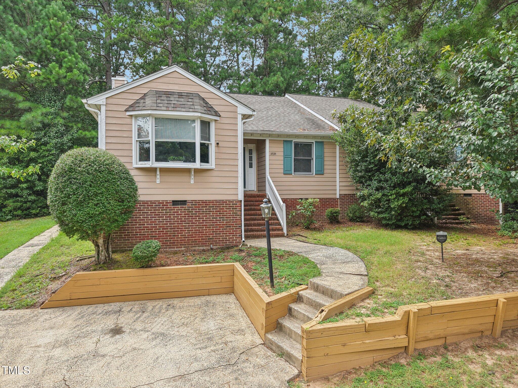 3534 Rawdon Drive Durham, NC 27713 - Photo 8 of 43 a front view of a house with garden