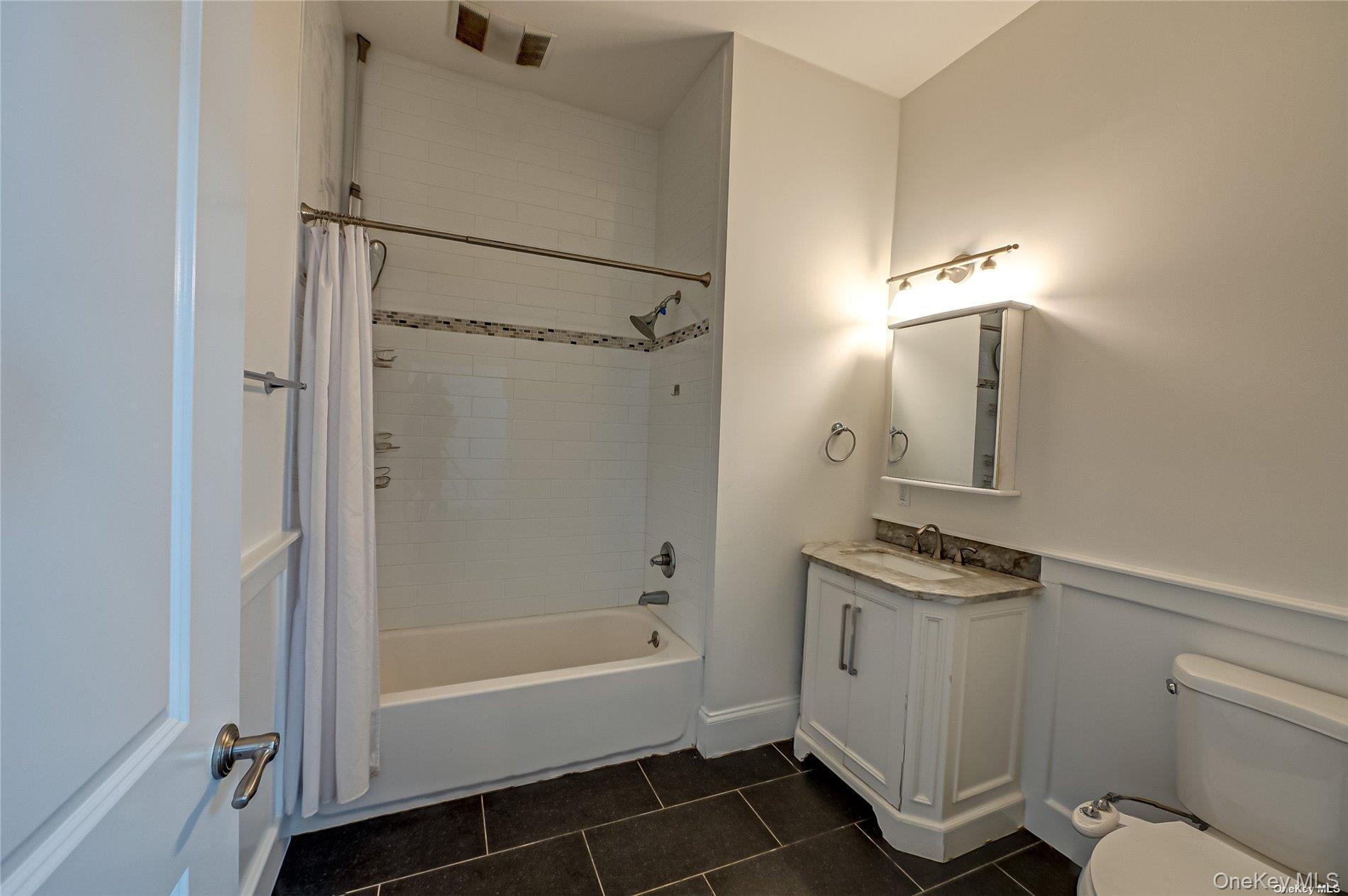50 Stewart Avenue, Unit 3A Huntington, NY 11743 - Photo 8 of 13 a bathroom with a bathtub a toilet and a shower