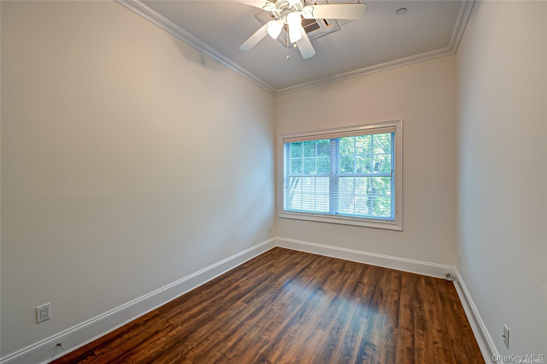 50 Stewart Avenue, Unit 3A Huntington, NY 11743 - Photo 9 of 13 wooden floor in an empty room with a window
