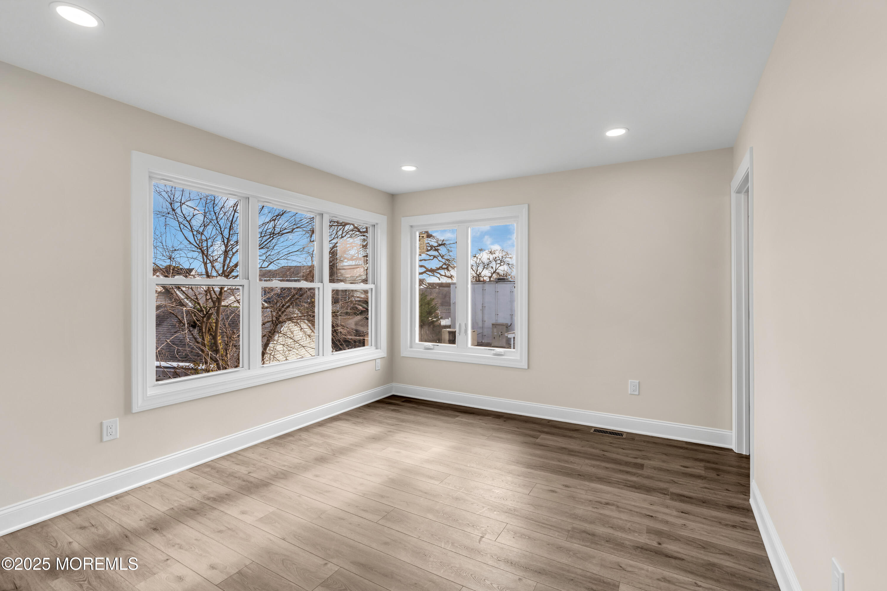 1900 Main Street Belmar, NJ 07719 - Photo 15 of 20 a view of an empty room with a window and wooden floor