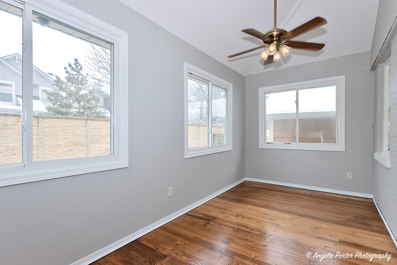 40 Pine Tree Row Lake Zurich, IL 60047 - Photo 14 of 31 a view of a room with wooden floor and windows