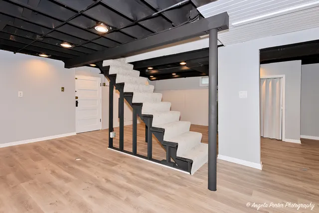 a view of hallway with wooden floor