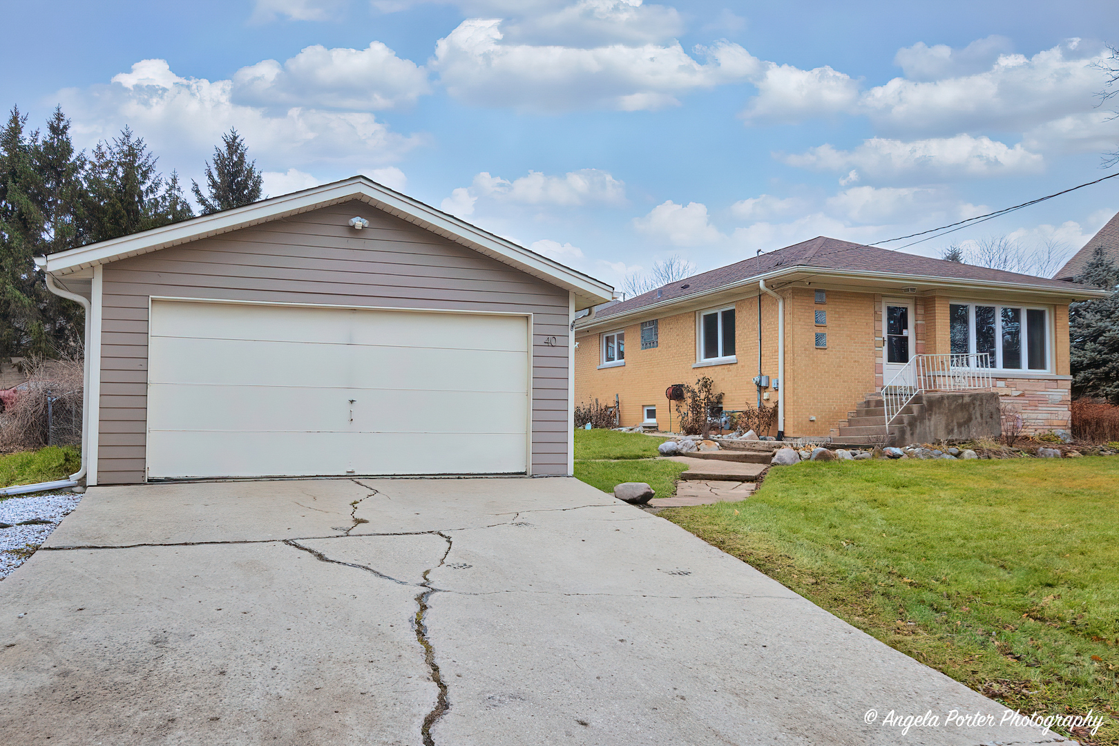 40 Pine Tree Row Lake Zurich, IL 60047 - Photo 23 of 31 a front view of a house with garden