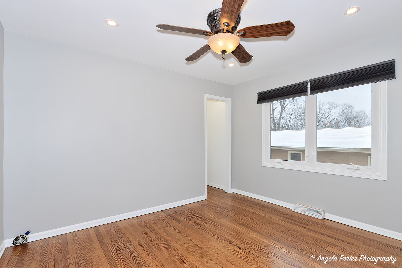 40 Pine Tree Row Lake Zurich, IL 60047 - Photo 9 of 31 an empty room with a window and a fan