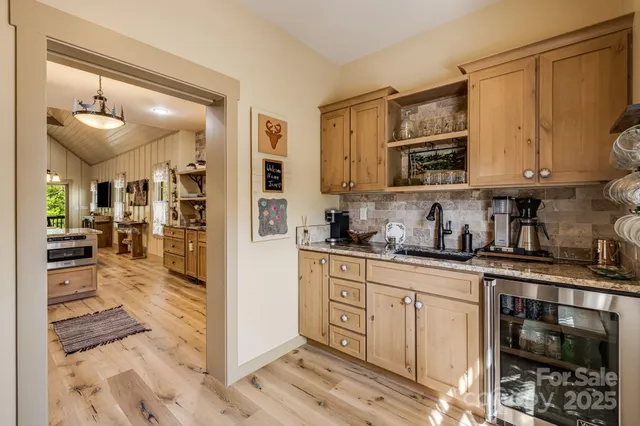 a kitchen with stainless steel appliances granite countertop a stove and cabinets