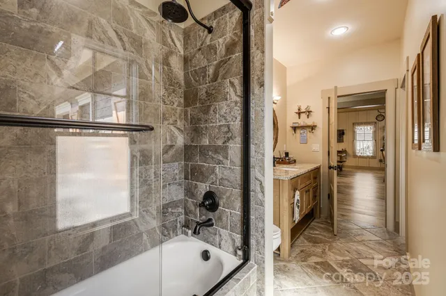 a bathroom with a tub and shower