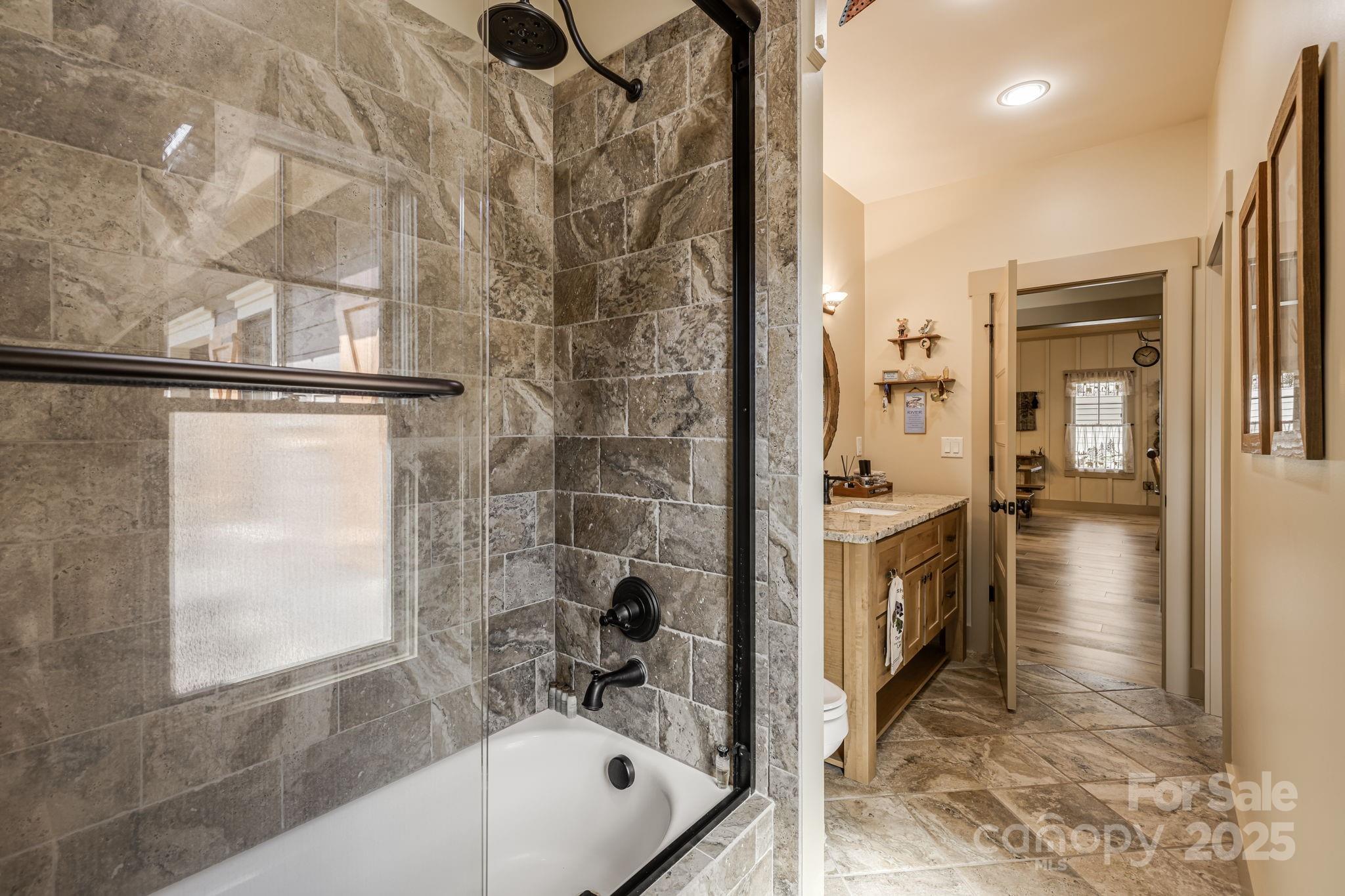 36 Chimney Stone Way Cullowhee, NC 28723 - Photo 18 of 47 a bathroom with a tub and shower