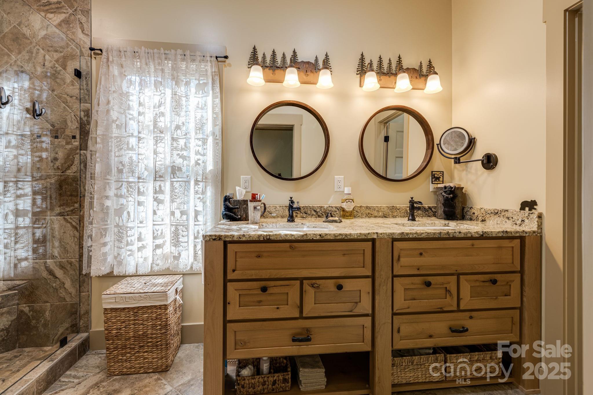 36 Chimney Stone Way Cullowhee, NC 28723 - Photo 25 of 47 a bathroom with a granite countertop sink and a mirror