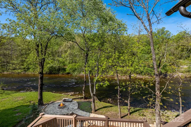 a view of yard from deck having patio