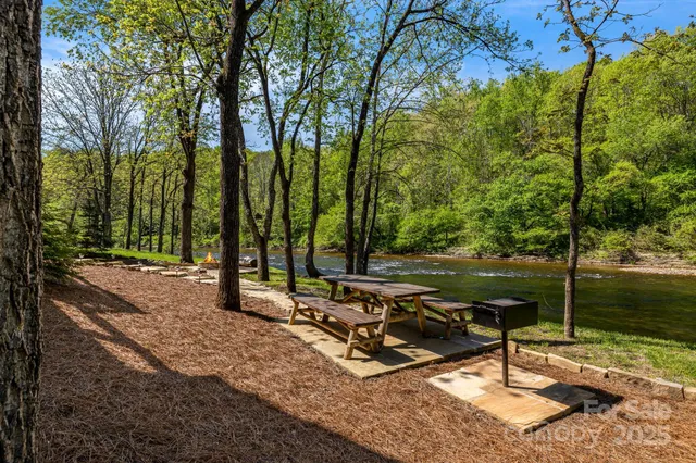 a view of a house with wooden fence