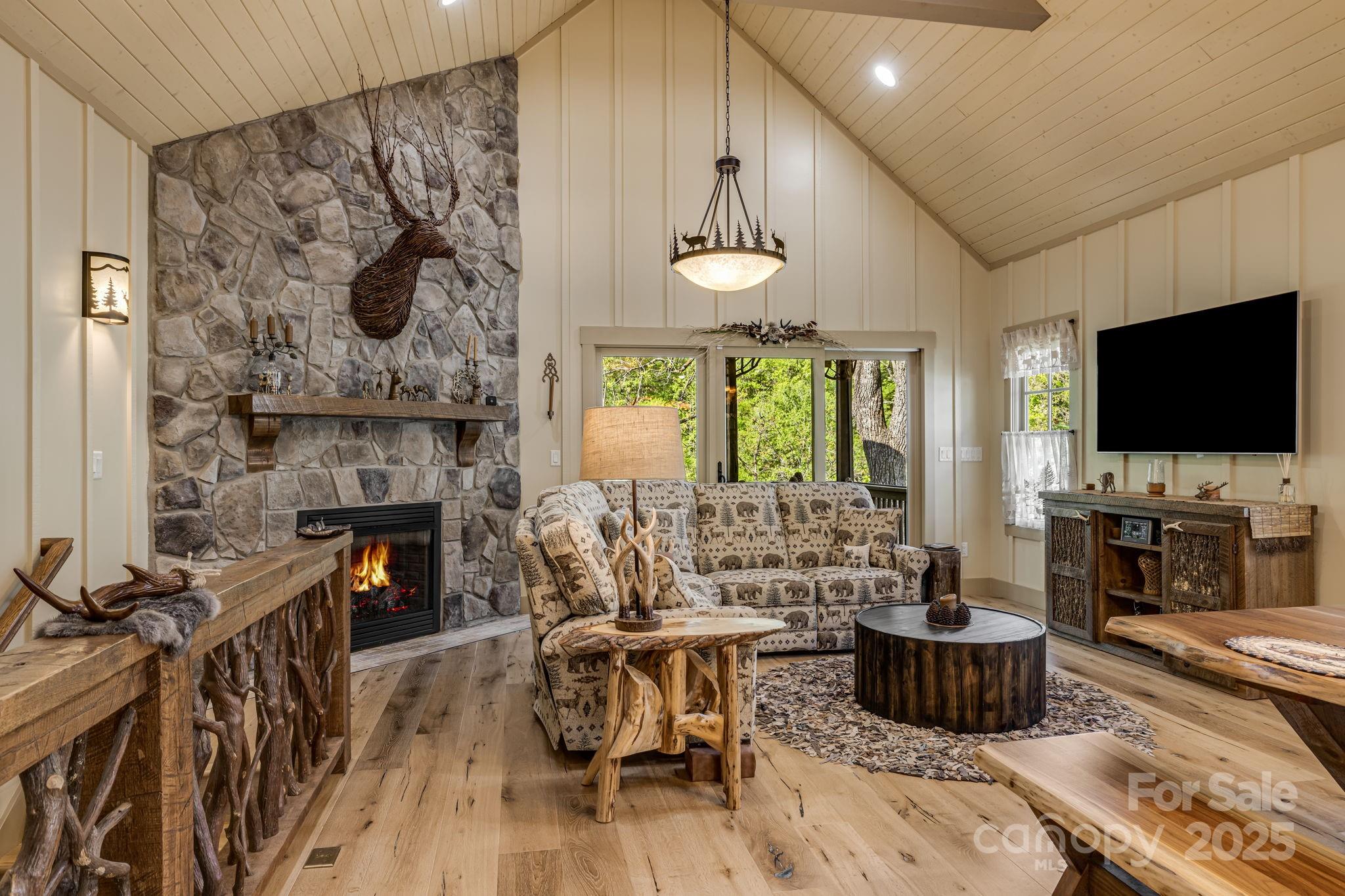 36 Chimney Stone Way Cullowhee, NC 28723 - Photo 5 of 47 a living room with furniture and a flat screen tv