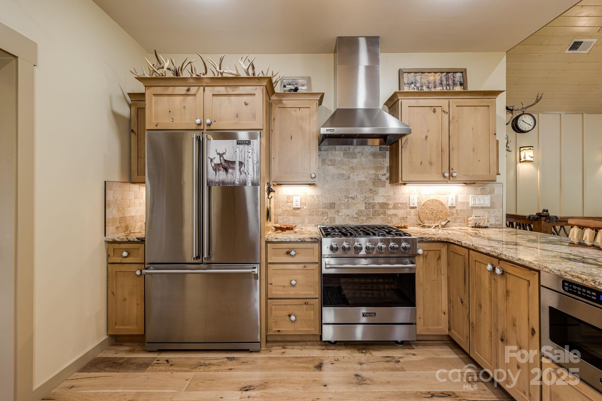 36 Chimney Stone Way Cullowhee, NC 28723 - Photo 9 of 47 a kitchen with stainless steel appliances granite countertop a refrigerator a stove and a sink