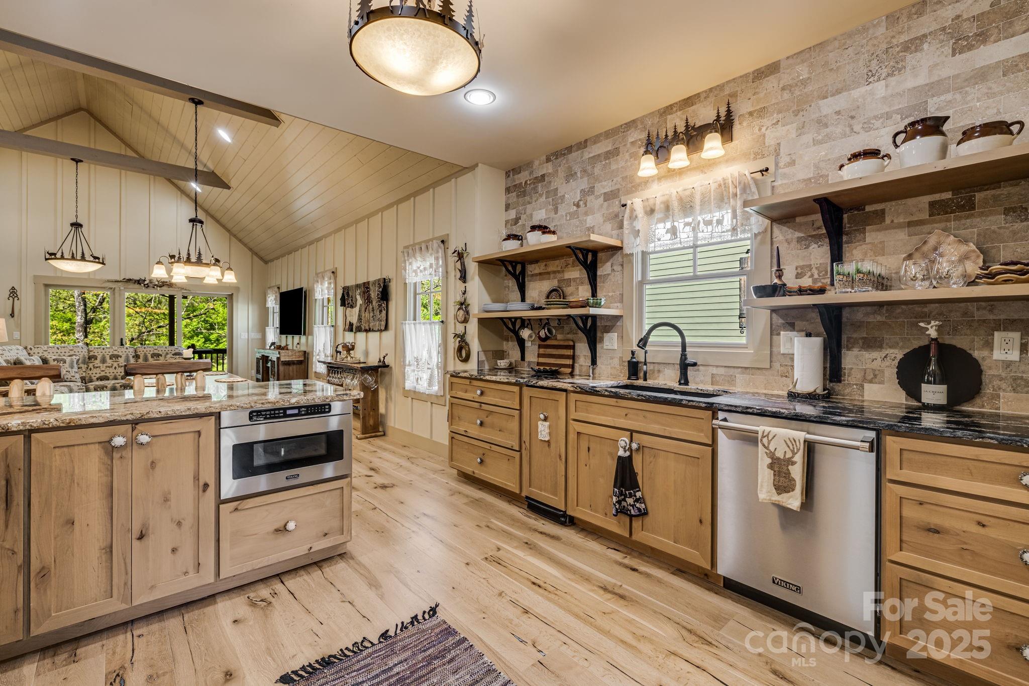 36 Chimney Stone Way Cullowhee, NC 28723 - Photo 10 of 47 a kitchen with stainless steel appliances granite countertop a stove and white cabinets