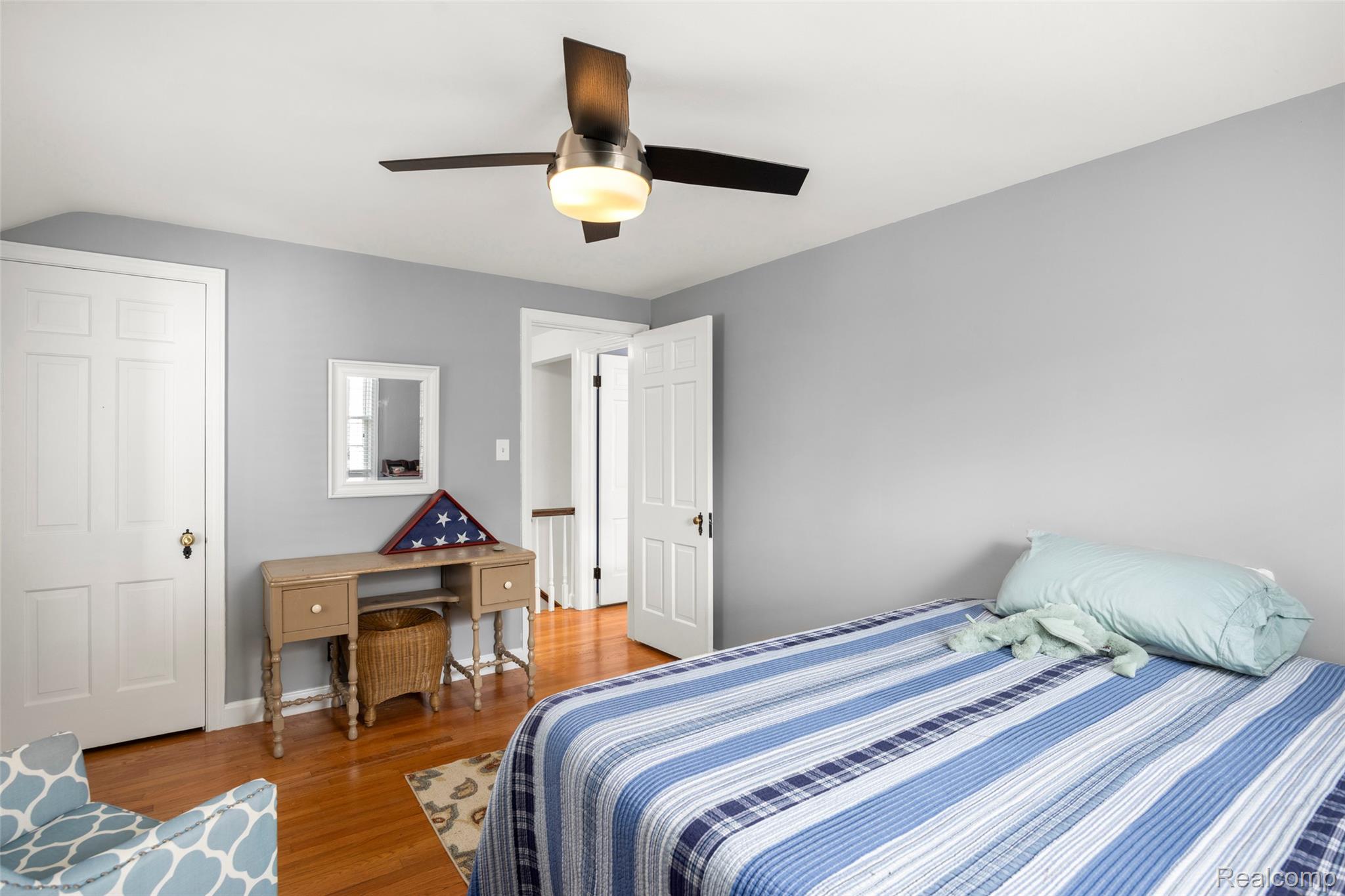 244 Kerby Road Grosse Pointe, MI 48236 - Photo 27 of 53 Bedroom featuring wood finished floors, ceiling fan, and lofted ceiling