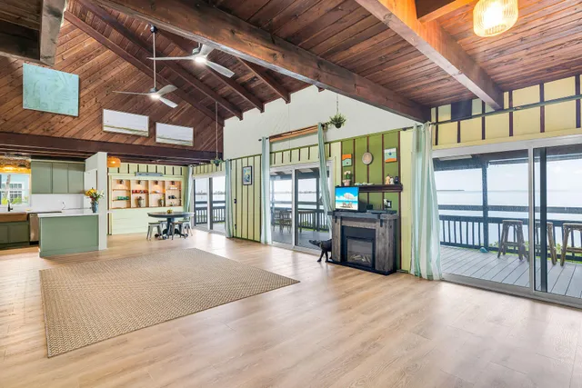 a view of an entryway with a table and chairs
