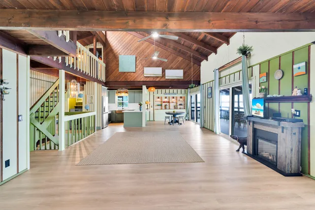 a kitchen with stainless steel appliances granite countertop a sink and a refrigerator