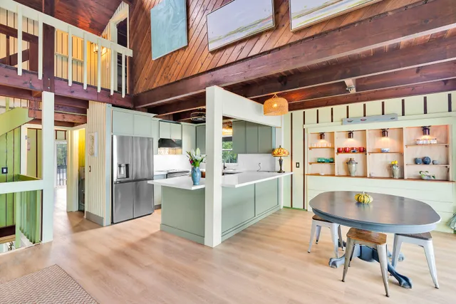 a kitchen with stainless steel appliances granite countertop a sink and dishwasher with wooden cabinets