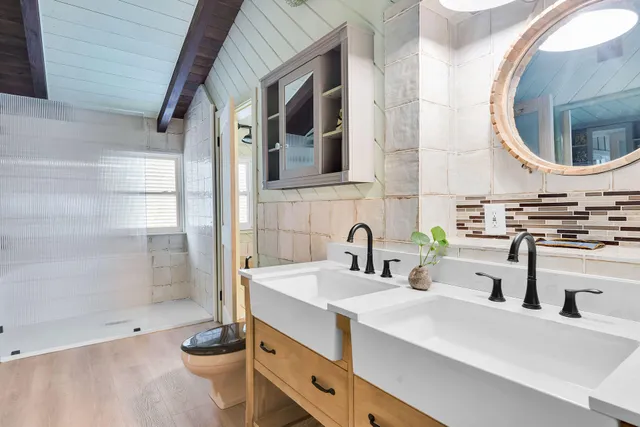 a spacious bedroom with a large bed and a large window