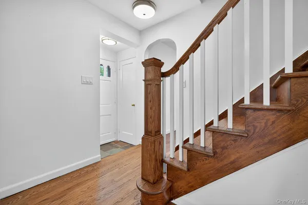 a view of entryway with wooden floor