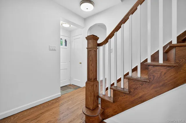 a view of entryway with wooden floor