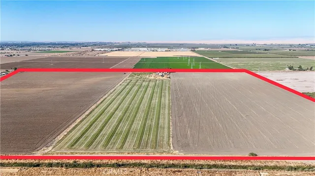 a backyard of a house with a table and chairs