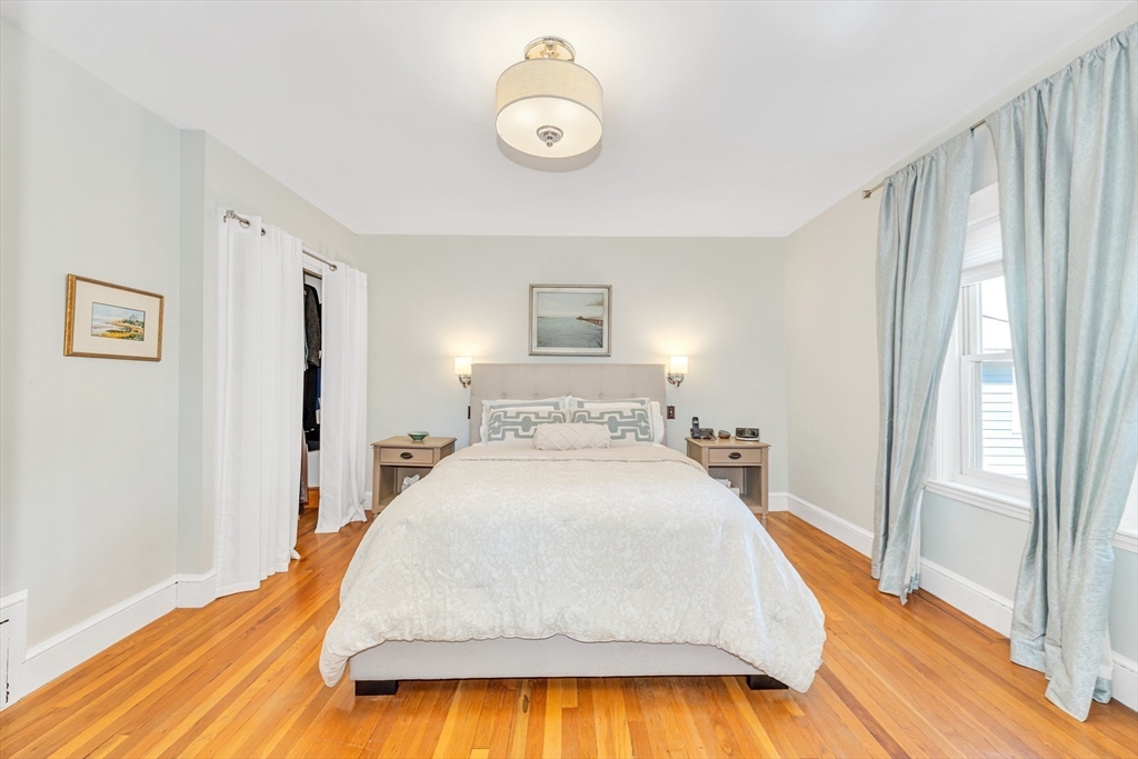 112 Perham Street Boston, MA 02132 - Photo 26 of 36 a spacious bedroom with a bed and a window