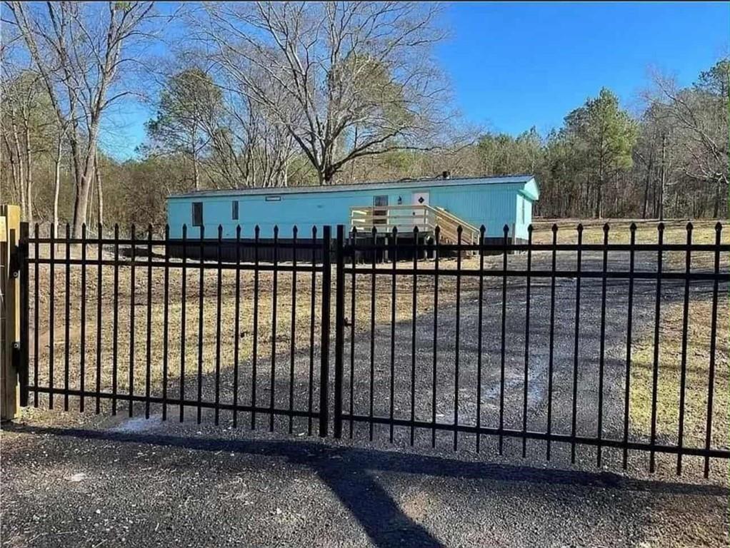 262 Blacks Bluff Road Southwest Rome, GA 30161 - Photo 3 of 11 a view of a black gate