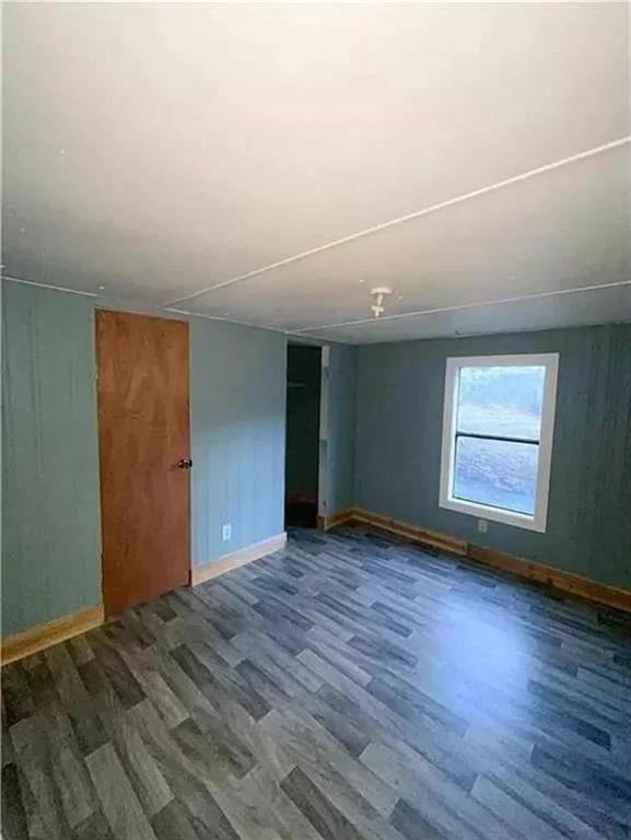 262 Blacks Bluff Road Southwest Rome, GA 30161 - Photo 6 of 11 an empty room with wooden floor and windows