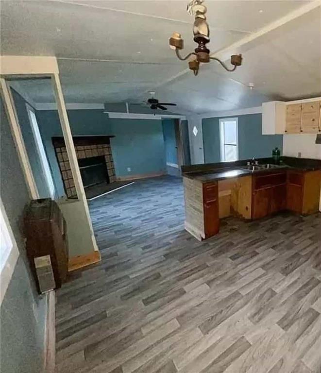 262 Blacks Bluff Road Southwest Rome, GA 30161 - Photo 9 of 11 a kitchen with stainless steel appliances granite countertop a stove and a wooden floors