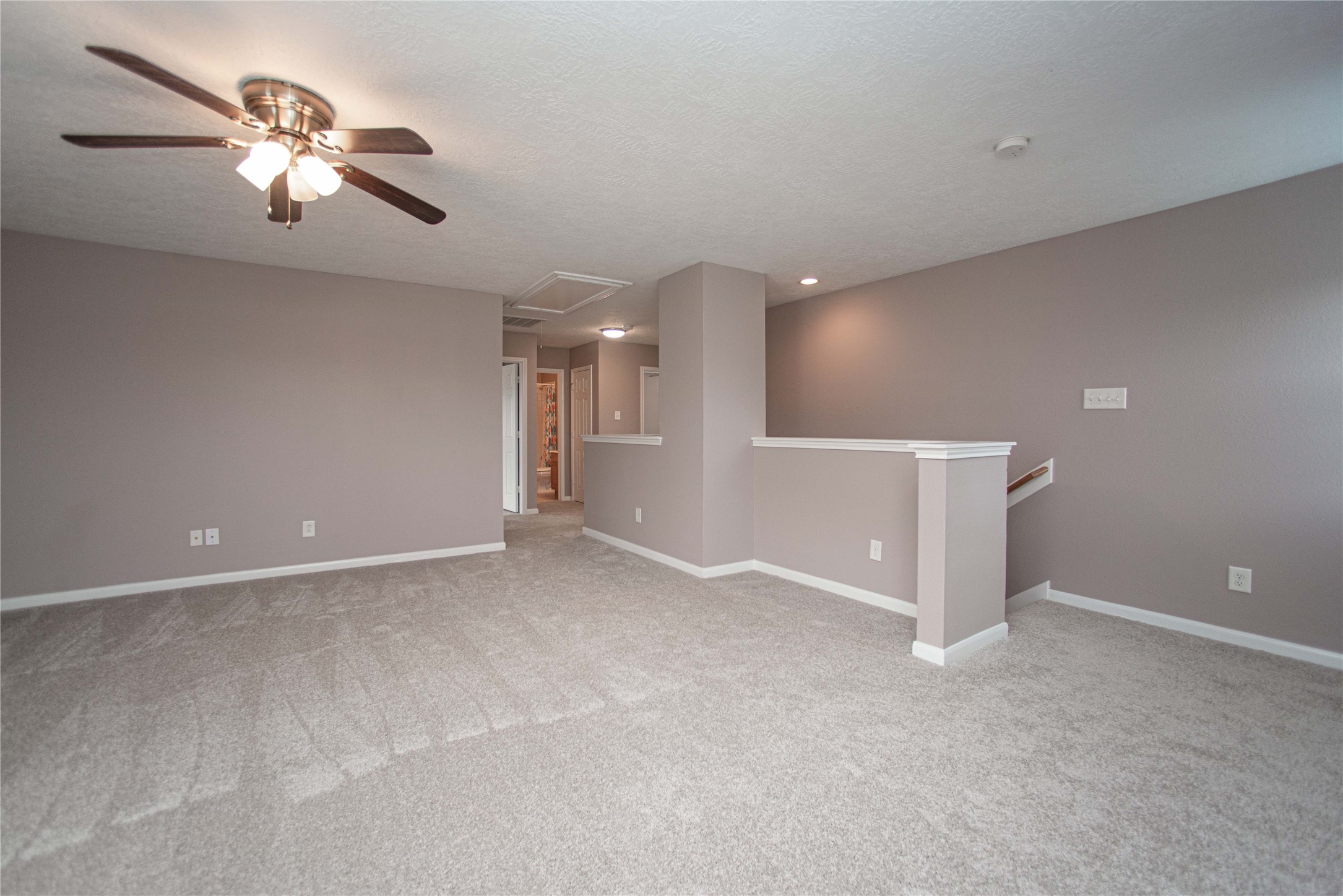 29314 Legends Bluff Drive Spring, TX 77386 - Photo 19 of 31 a view of an empty room with a ceiling fan