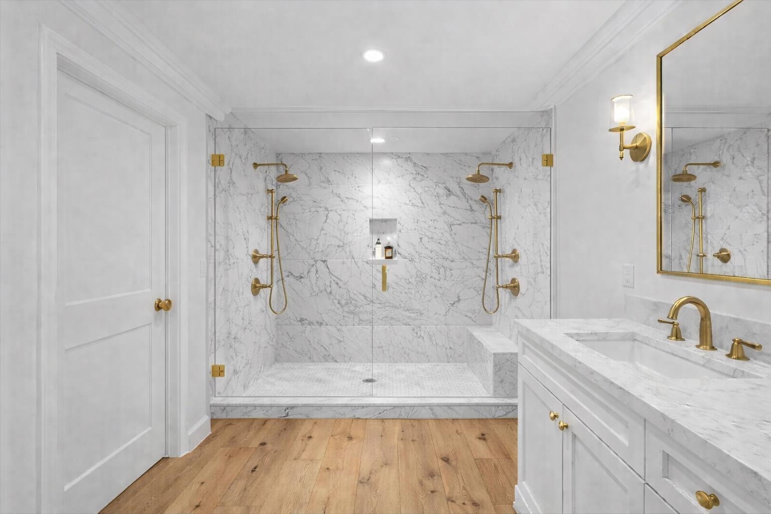 185 North Lena Street, Unit CONDO E Ridgway, CO 81432 - Photo 12 of 17 a bathroom with a granite countertop sink a mirror a bathtub and shower