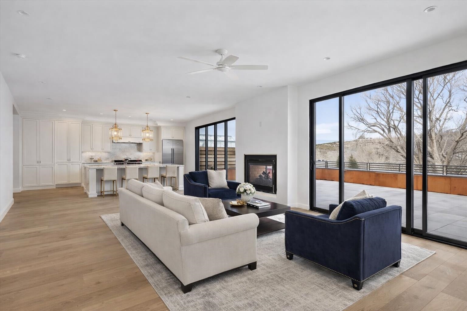 185 North Lena Street, Unit CONDO E Ridgway, CO 81432 - Photo 13 of 17 a living room with furniture and a large window