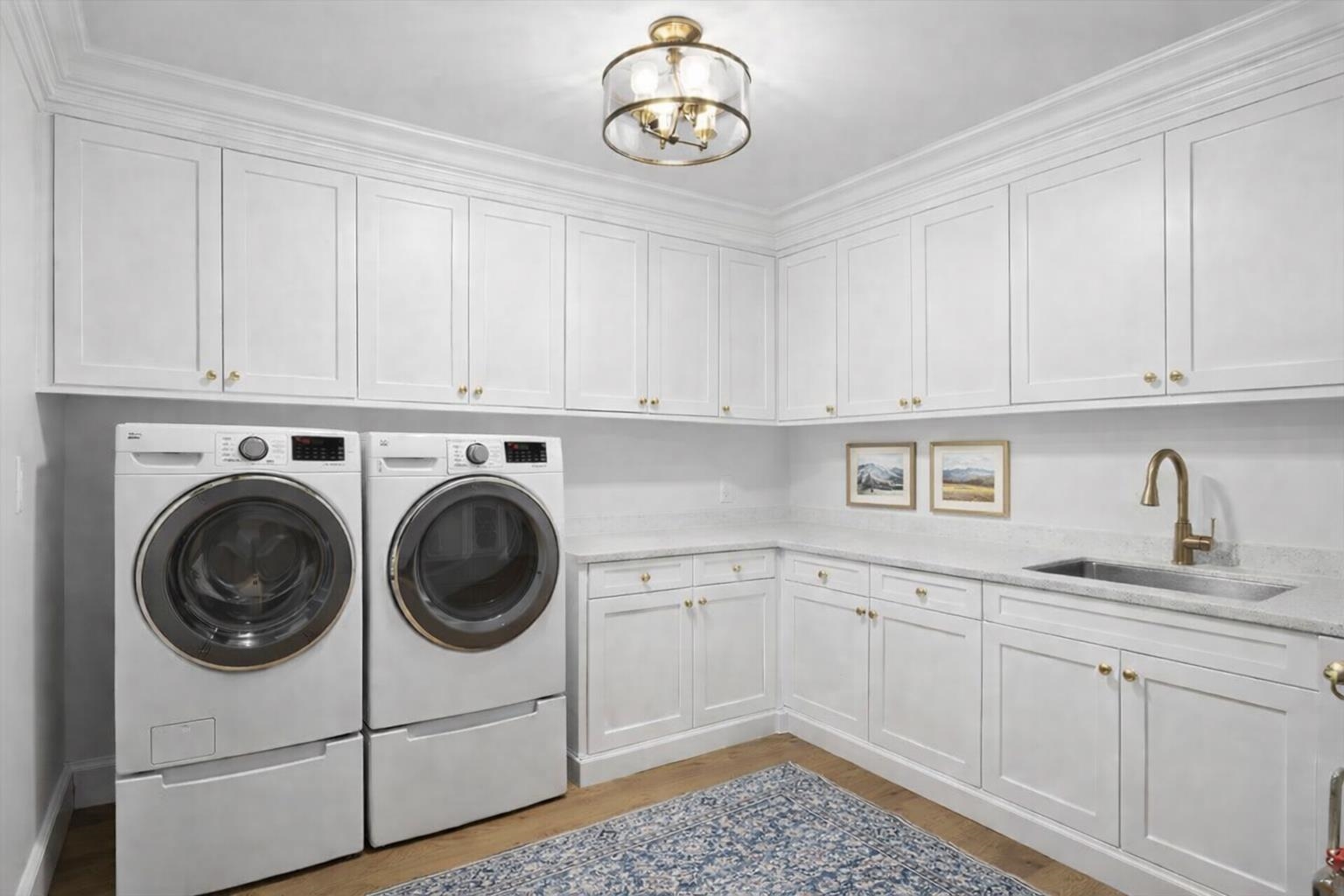 185 North Lena Street, Unit CONDO E Ridgway, CO 81432 - Photo 14 of 17 a view of a kitchen with cabinets dryer and washer