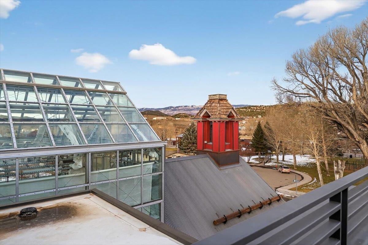 185 North Lena Street, Unit CONDO E Ridgway, CO 81432 - Photo 5 of 17 a view of a brick building with many windows