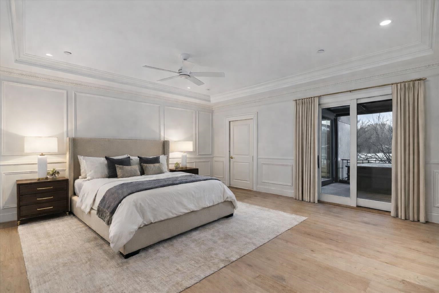 185 North Lena Street, Unit CONDO E Ridgway, CO 81432 - Photo 7 of 17 a spacious bedroom with a bed and a chandelier