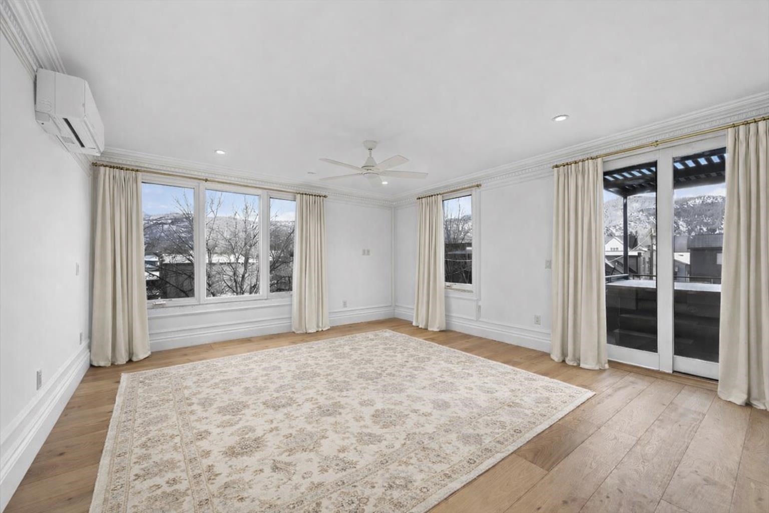 185 North Lena Street, Unit CONDO E Ridgway, CO 81432 - Photo 9 of 17 wooden floor in an empty room with a window