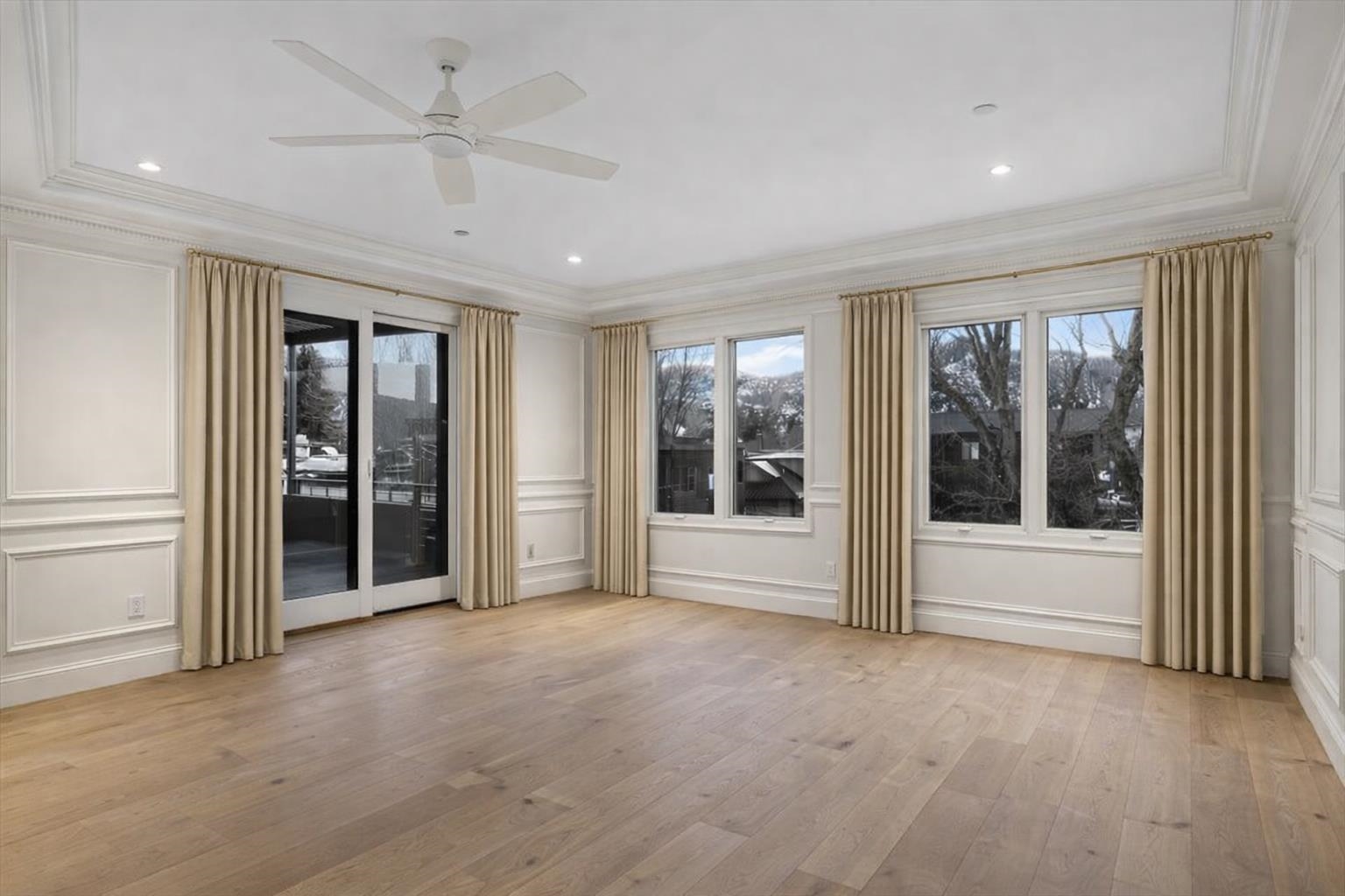 185 North Lena Street, Unit CONDO E Ridgway, CO 81432 - Photo 10 of 17 a view of a livingroom with a chandelier fan and windows