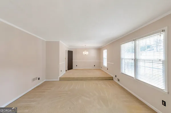 a view of an empty room with a window