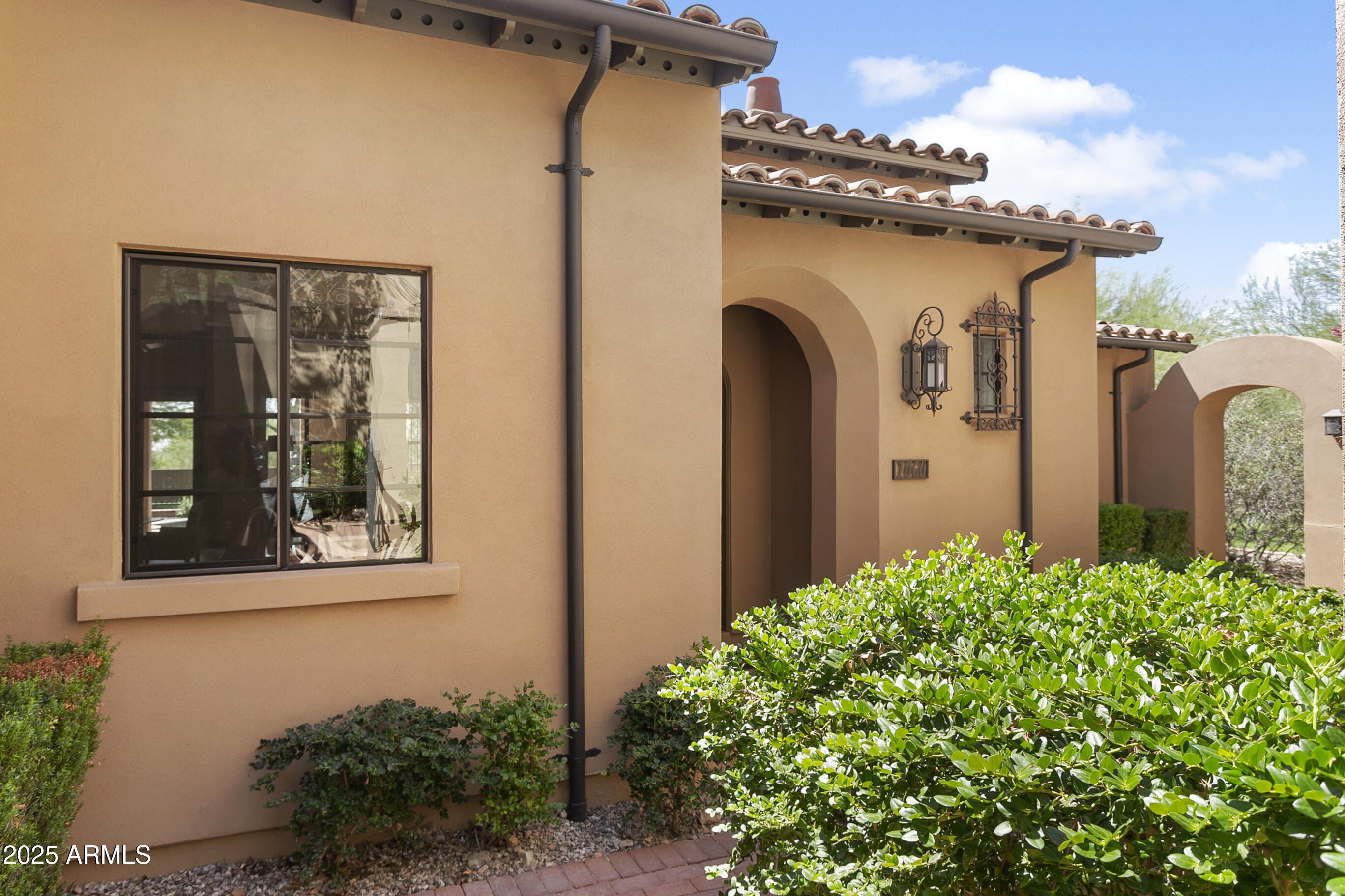 a front view of a house with garden