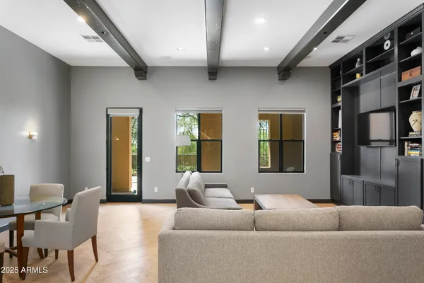 a living room with furniture and a large window